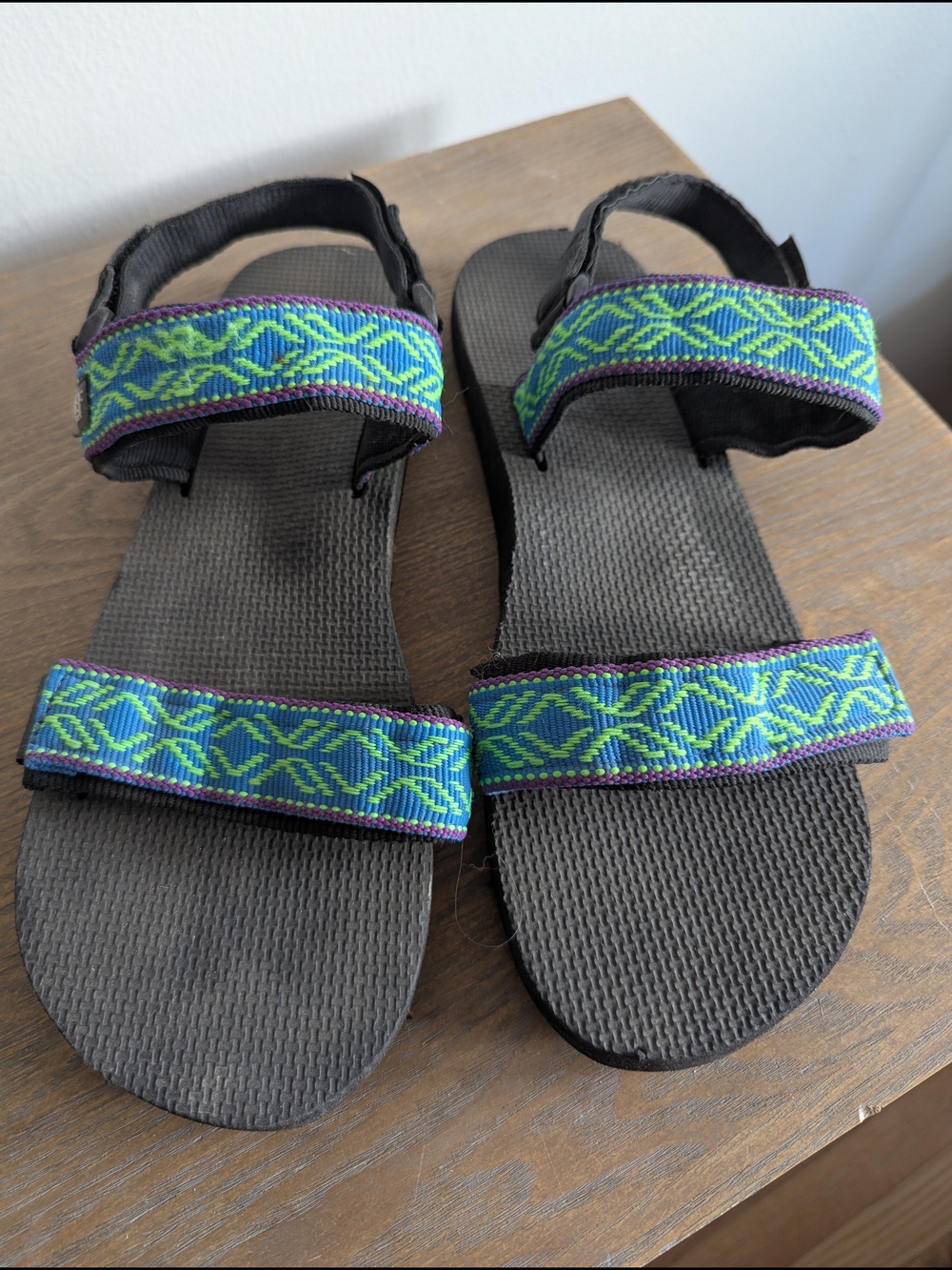 Reef Black Sandals with Green and Blue Patterned Straps